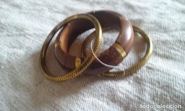 Nuevo: brazaletes de madera  y dorados - Foto 1