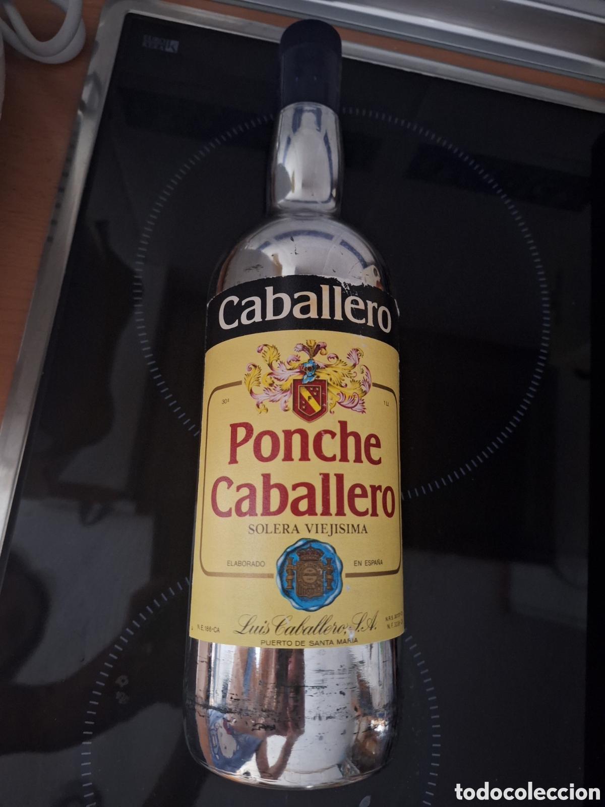 Otras botellas y bebidas antiguas de colecci&oacute;n: Botella vacia Ponche Caballero