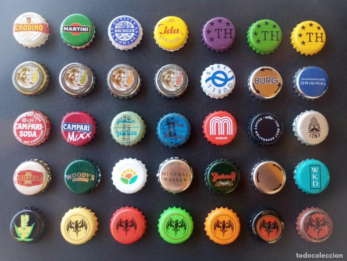 Otras botellas y bebidas antiguas de colecci&oacute;n: Lote de 35 chapas tap&oacute;n corona usadas DIFERENTES, de refrescos, zumos, aguas, ... etc (Q)
