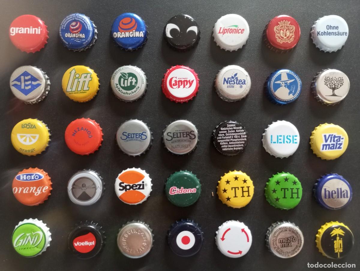Otras botellas y bebidas antiguas de colecci&oacute;n: Lote de 35 chapas tap&oacute;n corona usadas DIFERENTES, de refrescos, zumos, aguas, ... etc (S)
