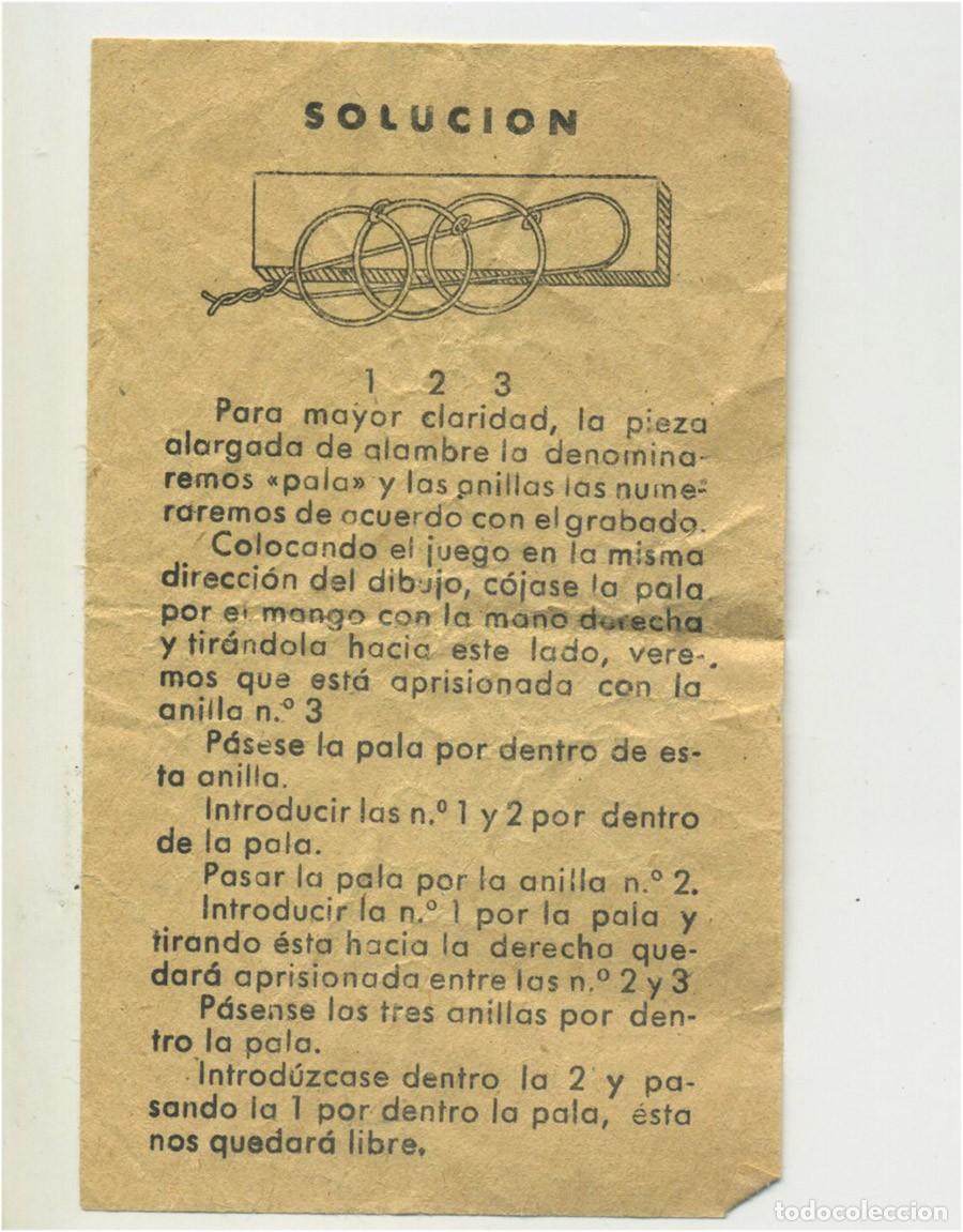 Collectionnisme Papier divers: SOLUCI&Oacute;N AL TRUCO DE LOS AROS ENGANCHADOS