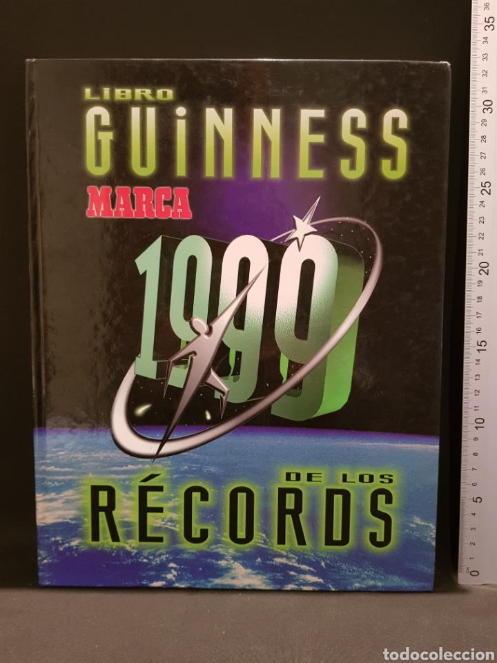Coleccionismo deportivo: Libro Guinness de los r&eacute;cords 1999 Marca - Foto 1