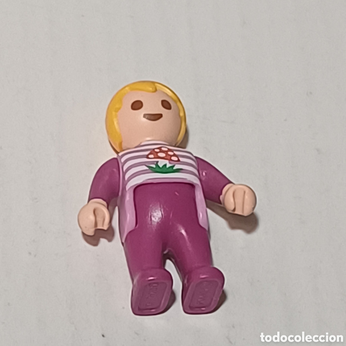 Playmobil: Figura Playmobil ni&ntilde;o beb&eacute; rubio camiseta rosa piernas magenta