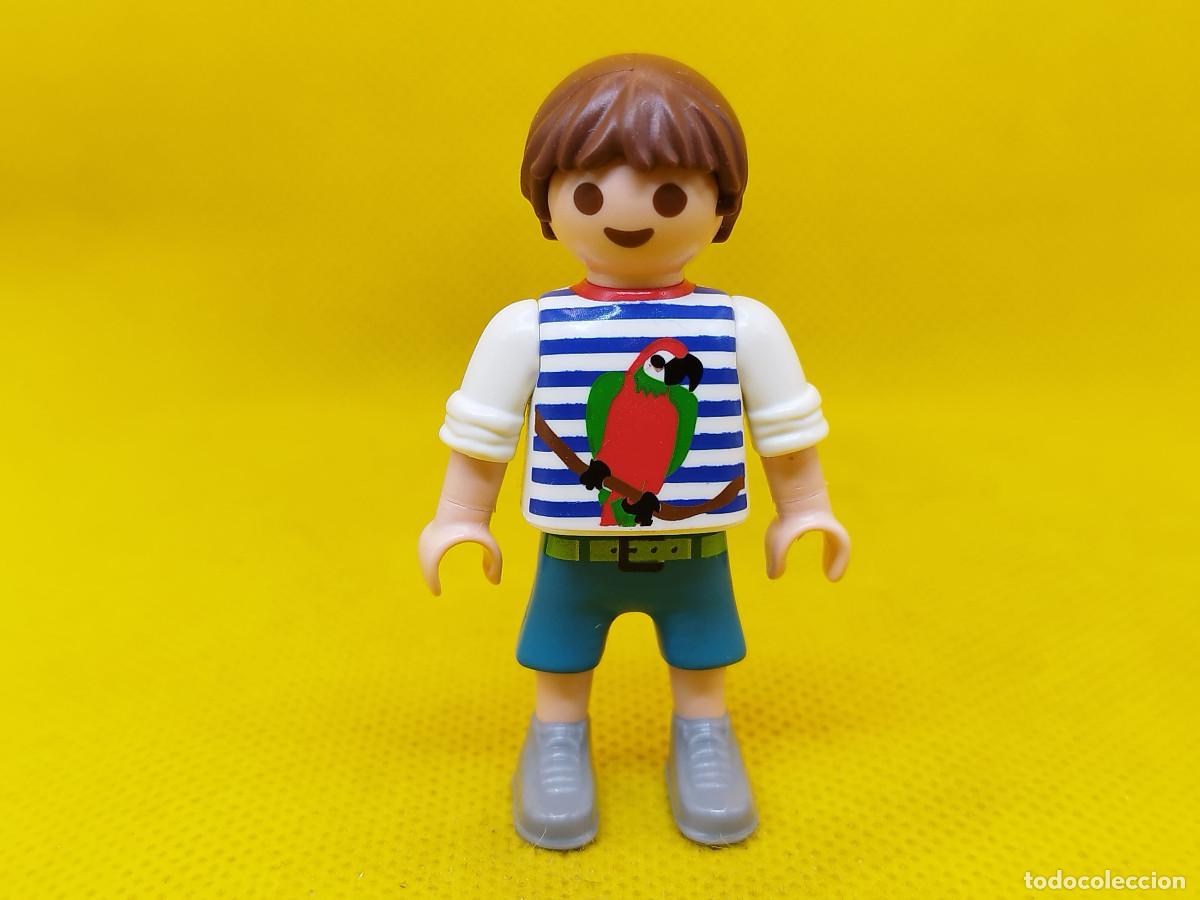 Playmobil: Playmobil Ni&ntilde;o con loro en la camiseta