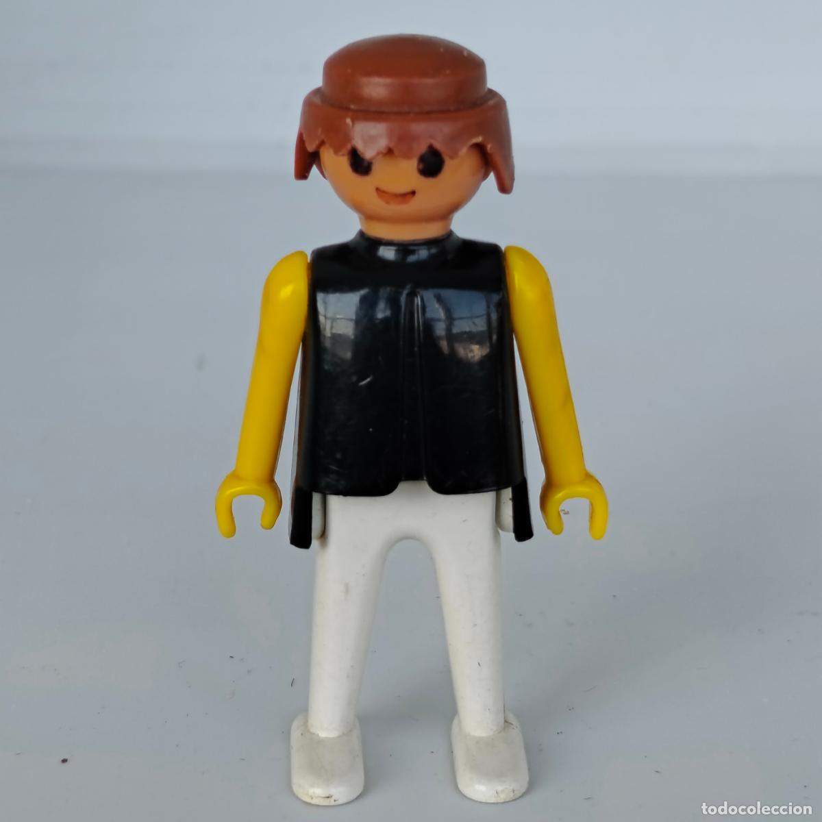 Playmobil: Famobil Playmobil Click de manos fijas, pecho negro y brazos y piernas amarillas