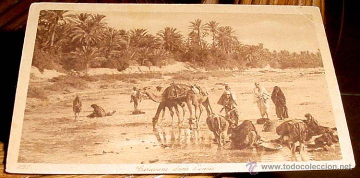 Postais: ANTIGUA POSTAL DE MARRUECOS - CARAVANA EN UN OASIS - ED.L.L - NO CIRCULADA.