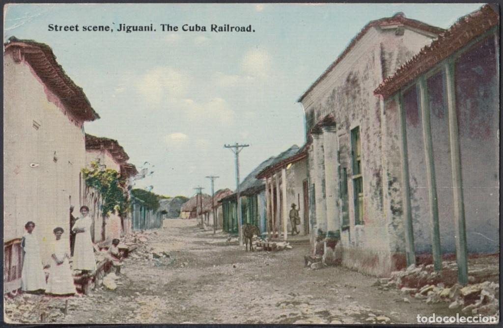Cartes Postales: POS-725 CUBA POSTCARD. CIRCA 1930. JIGUANI. RAILROAD STREET. STREET SCENE.