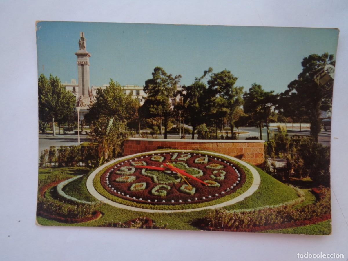 Postales: POSTAL DE CADIZ : PLAZA DE ESPA&Ntilde;A , RELOJ FLORAL Y MONUMENTO A LAS CORTES. A&Ntilde;OS 60