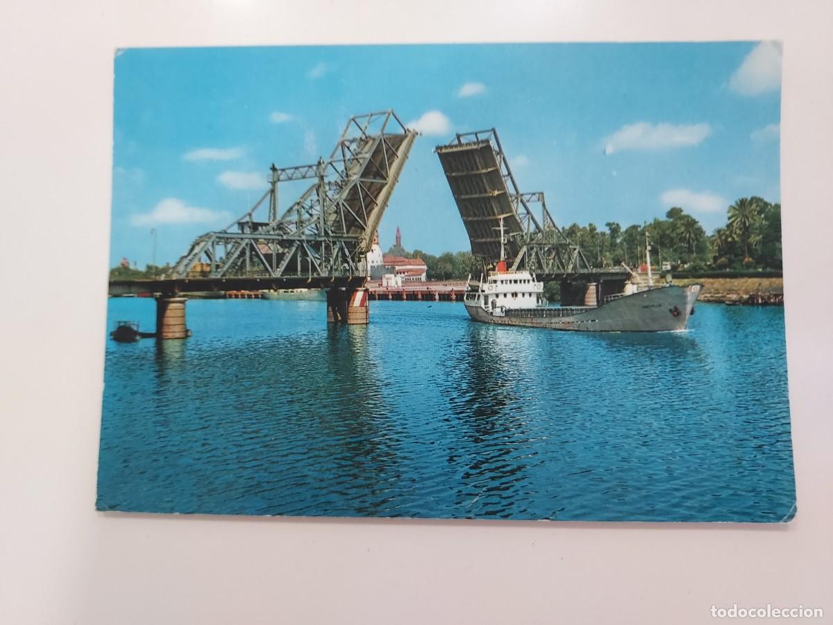 Postales: POSTAL SEVILLA PUENTE ALFONSO XIII SOBRE EL GUADALQUIVIR. 1973. ESCRITA