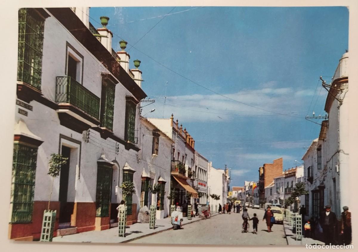 Postales: POSTAL LOS PALACIOS CALLE REAL. 1968. ESCRITA. SEVILLA. MOTO VESPA