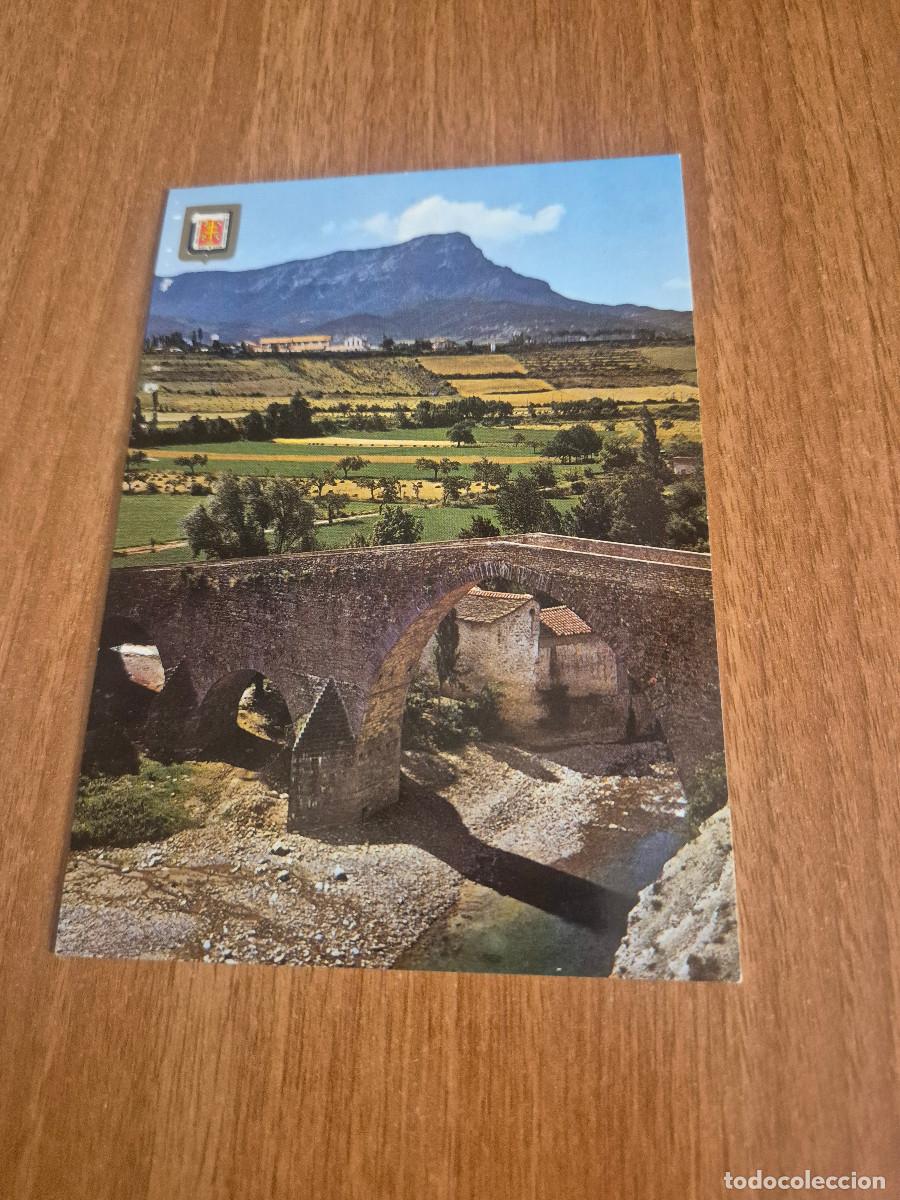Cartoline: POSTAL PIRINEO ARAGONES JACA PUENTE ROMANICO DE SAN MIGUEL AL FONDO LA PE&Ntilde;A OROEL SIN CIRCULAR.