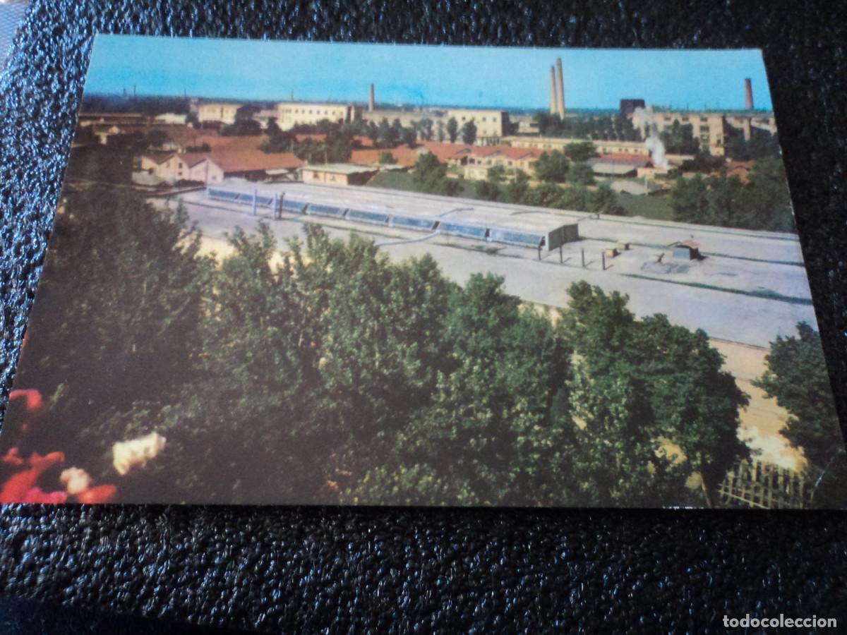 Postales: a factory area covered with trees - Foto 1