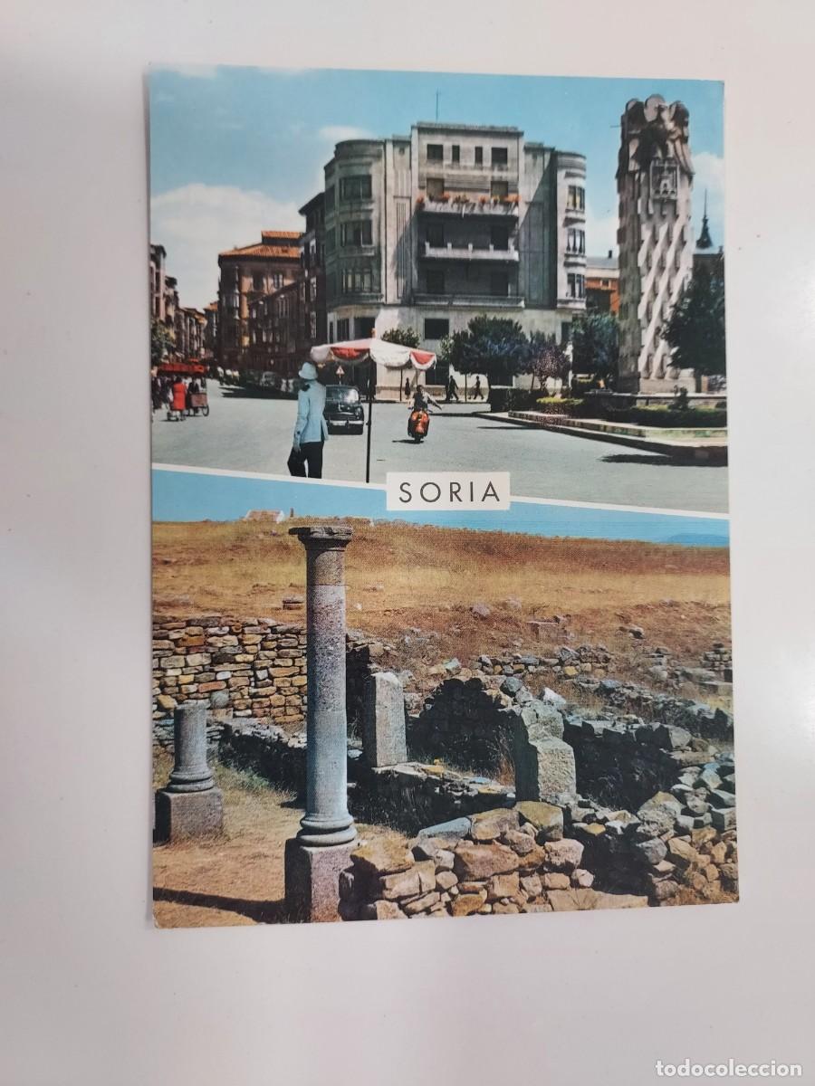 Postales: POSTAL SORIA ASPECTO URBANO RUINAS NUMANCIA. 1964. SIN CIRCULAR. Moto Vespa, polic&iacute;a tr&aacute;fico