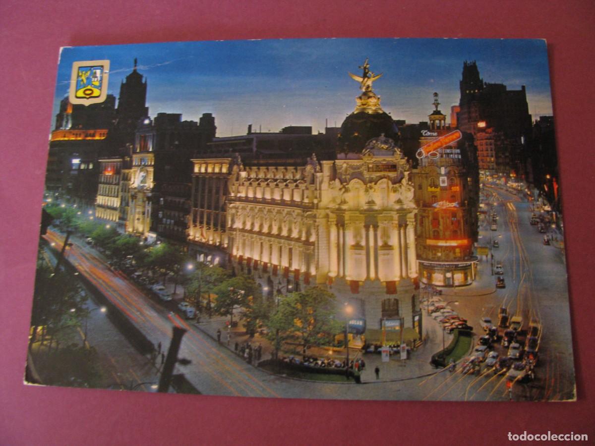 Postales: POSTAL DE MADRID. EDIFICIO FENIX. CALLE DE ALCALA Y AVENIDA JOSE ANTONIO. VISTA NOCTURNA.