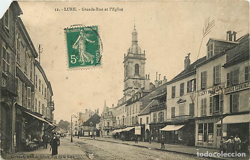 Postales: France - 70 - Lure - Grande Rue et l'Eglise - Anim&eacute;e - Oblit&eacute;ration ronde de 1914 - Etat &eacute;corn&eacute;e - C