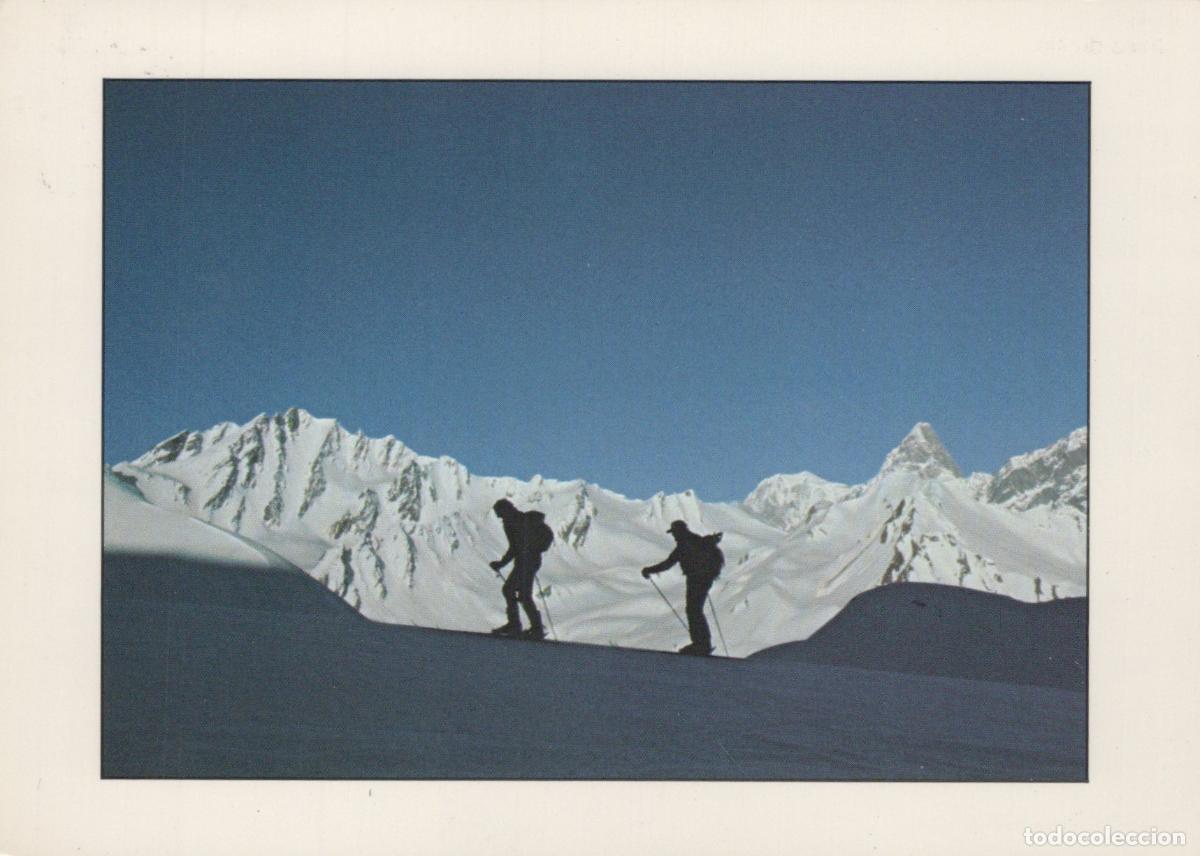 Postales: Switzerland Haute Nendaz Two Skiers Silhouetted Against A Snowy Mountain *YAM983