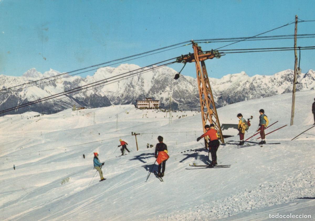 Postkarten: Italy Belluno Skiers On A Snowy Mountain Slope With A Ski Lift and A *YAN105