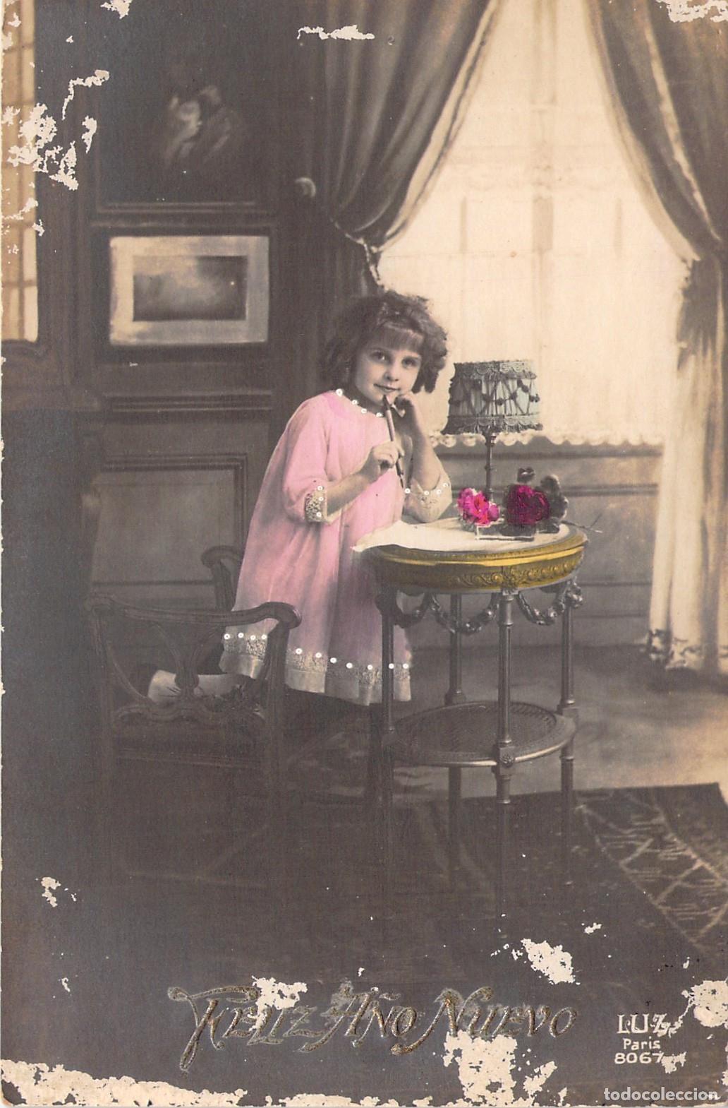 Postales: Postal antigua de ni&ntilde;a escribiendo una carta por A&ntilde;o Nuevo