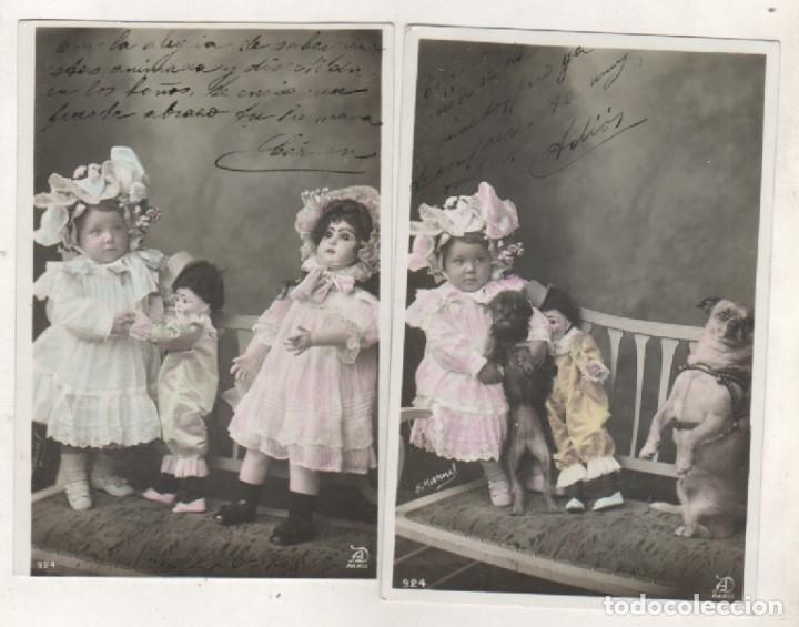 Postales: Dos postales de ni&ntilde;a con juguetes, mu&ntilde;eca, y perros. - Foto 1