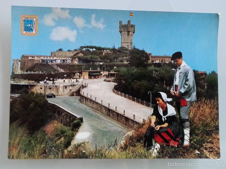 Cartes Postales: ANTIGUA POSTAL DE SAN SEBASTIAN N&ordm; 32 MONTE IGUELDO Y PAREJA TIPICA POSTALES ESCUDO DE ORO A&Ntilde;OS 60