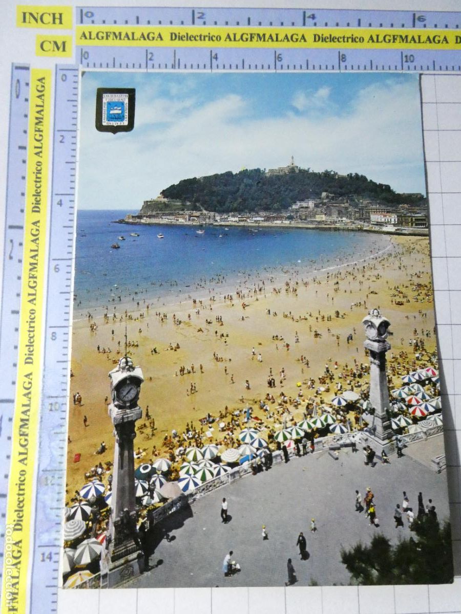 Postales: POSTAL DE GUIP&Uacute;ZCOA. A&Ntilde;O 1966. SAN SEBASTIAN RELOJES PLAYA DE LA CONCHA 127 ESCUDO ORO. 685