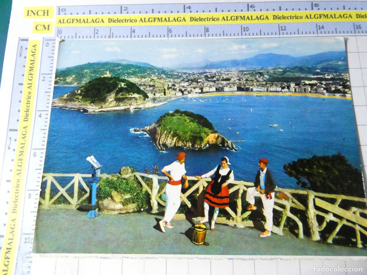 Postales: POSTAL DE GUIP&Uacute;ZCOA. A&Ntilde;O 1970. SAN SEBASTIAN, VISTA DESDE IGUELDO TRAJES T&Iacute;PICOS. 104 MANIPEL 695