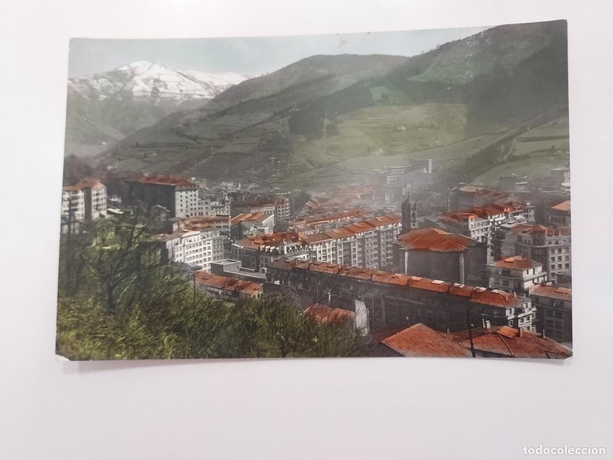 Postales: POSTAL EIBAR VISTA PARCIAL. A&Ntilde;OS 1950. COLOREADA. ESCRITA. GUIPUZCOA