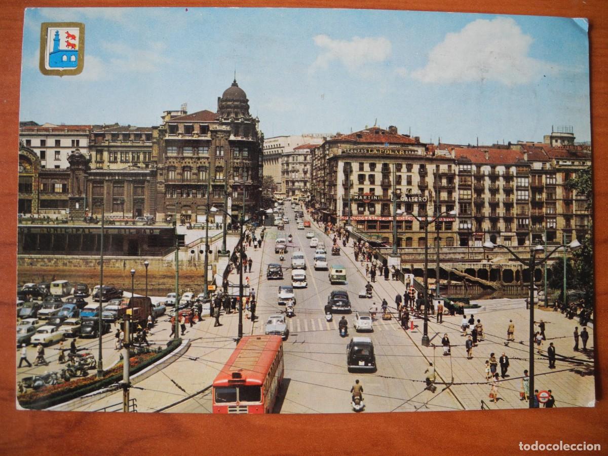 Postales: Bilbao. Puente de la Victoria y calle Navarra. Ed. Dominguez n. 3. Circulada 1964. Coches.
