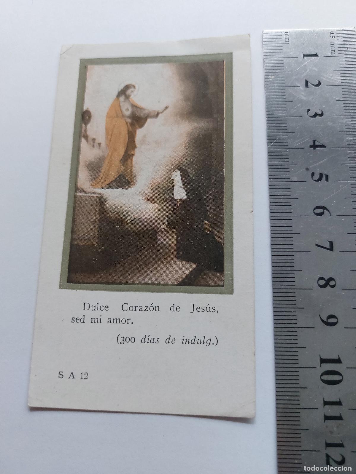 Postales: Estampa religiosa del Sagrado Coraz&oacute;n de Jes&uacute;s y monja en oraci&oacute;n