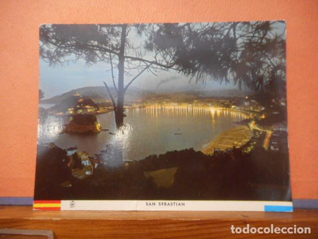 Postales: BONITA POSTAL CIRCULADA. SAN SEBASTIAN. VISTA GENERAL NOCTURNA DESDE EL PINAR