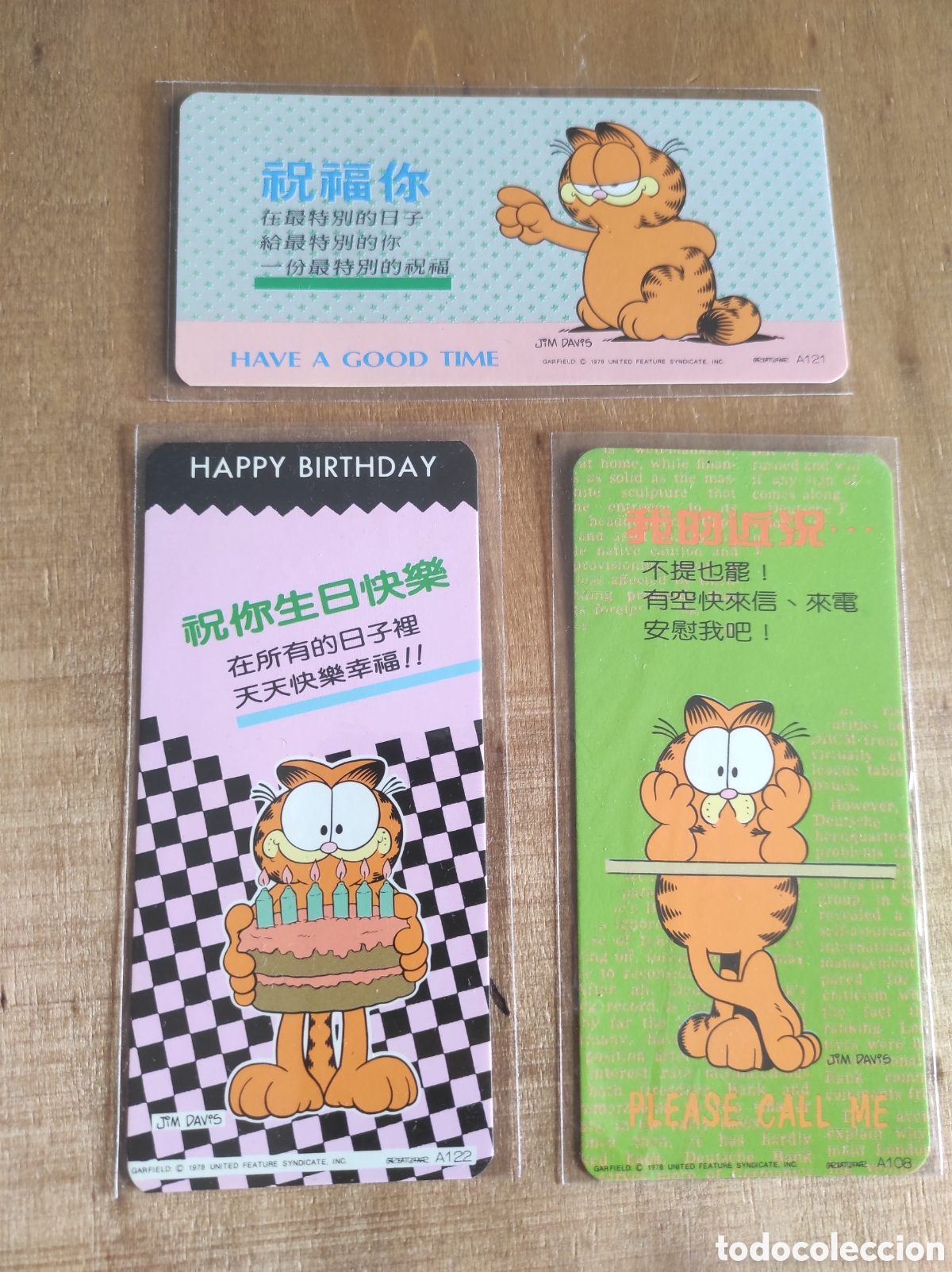 Postales: Tarjetas de felicitaci&oacute;n plastificadas de Garfield. Texto en chino e ingl&eacute;s
