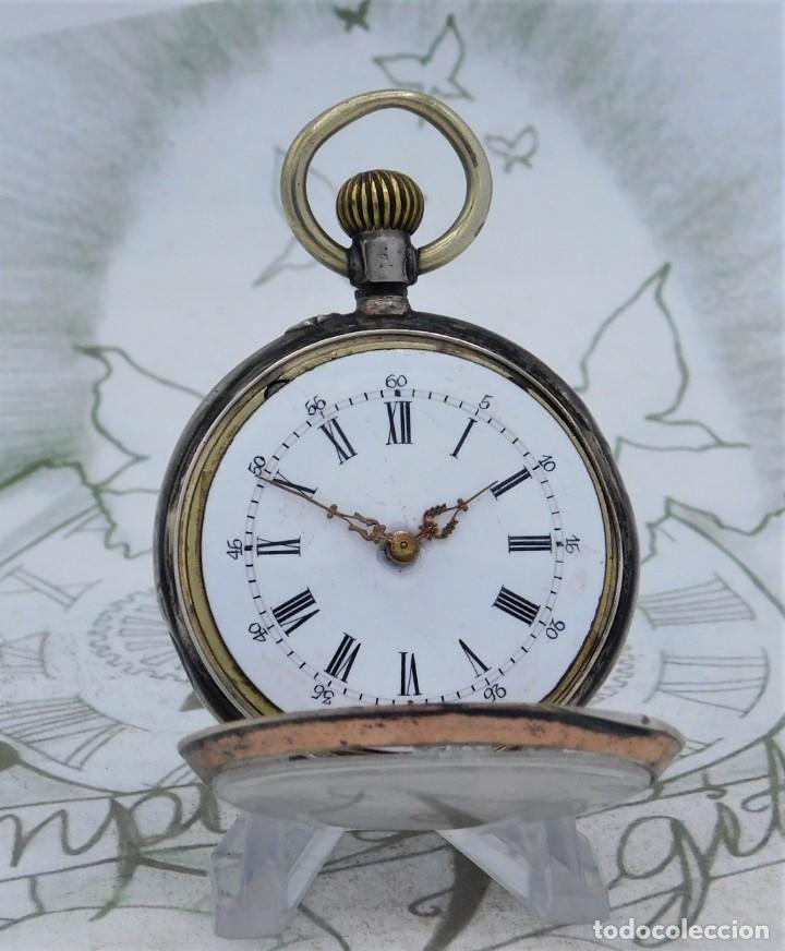 reloj de bolsillo en plata de suiza, funcionando y circa 1900