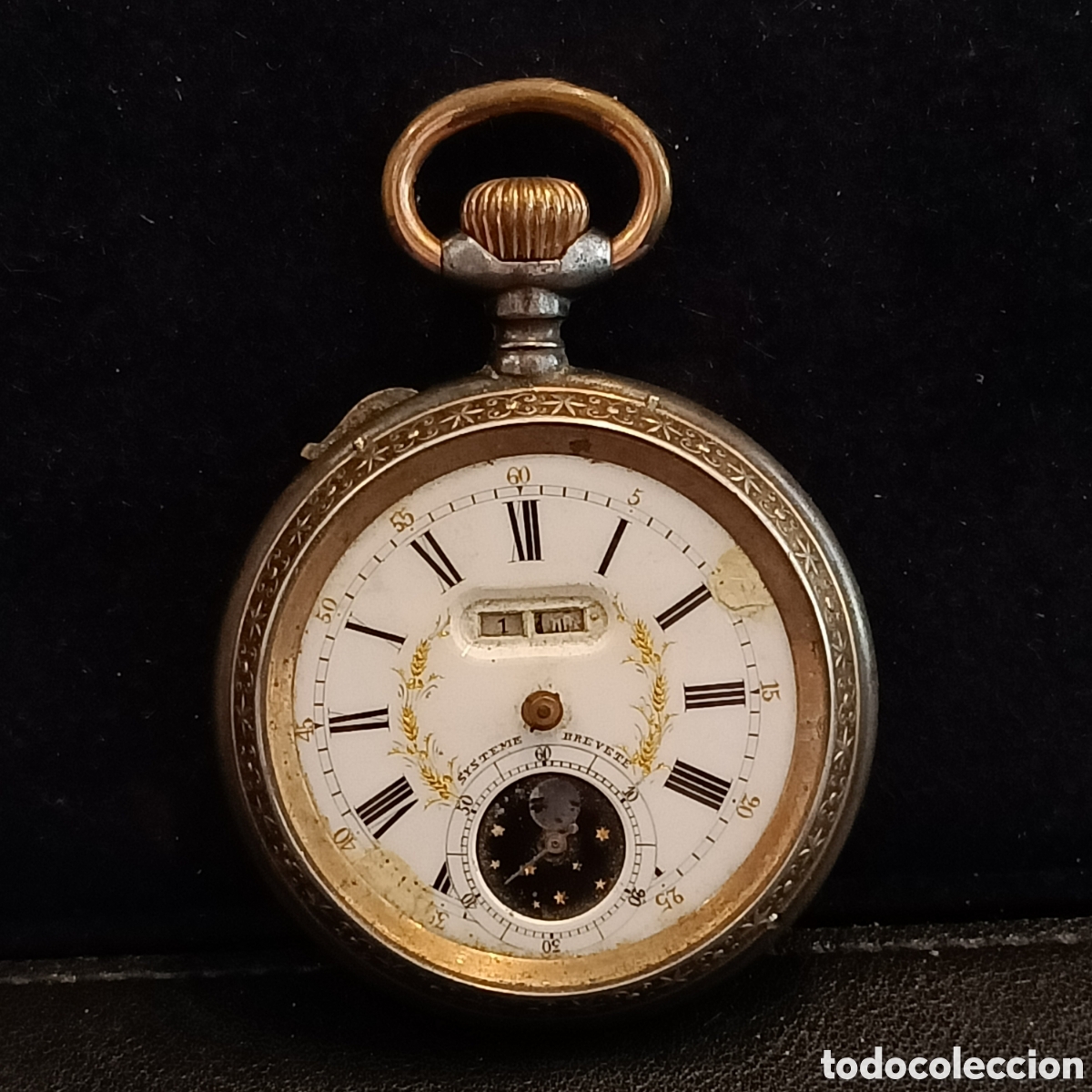 Relojes de bolsillo: Reloj de bolsillo crga manual , con doble calendario y fase lunar.