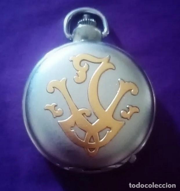Relojes de bolsillo: Original reloj de bolsillo plateado y dorado con 2 movimientos, esferas, con filigranas 5cm di&aacute;m....