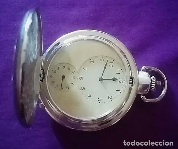 Rel&oacute;gios de bolso: Original reloj de bolsillo plateado y dorado con 2 movimientos, esferas, con filigranas 5cm di&aacute;m....