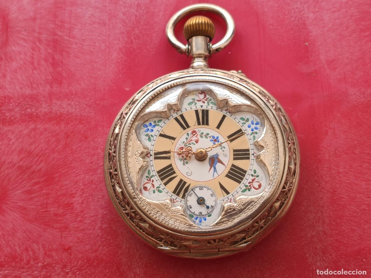 Relojes de bolsillo: Excelente reloj de plata labrada y esfera iluminada, en funcionamiento