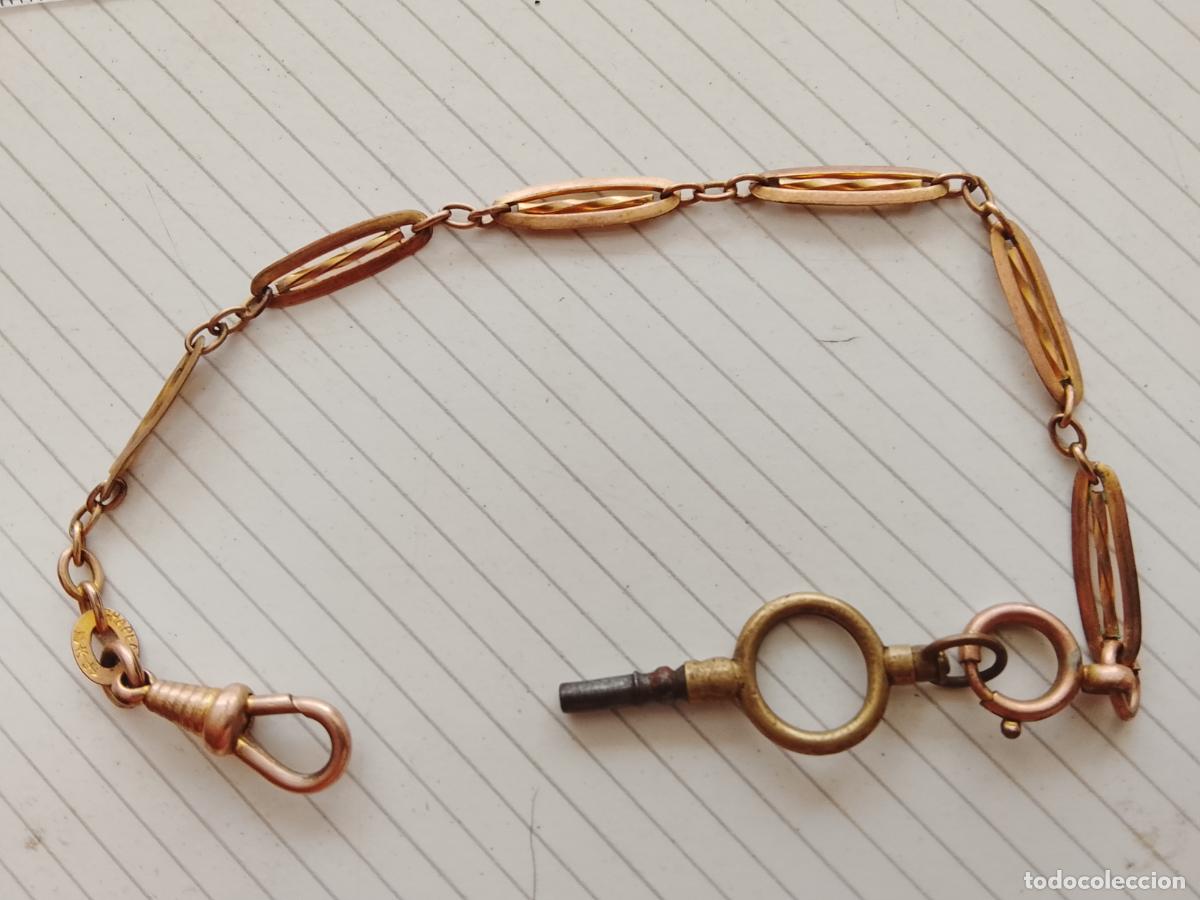 Relojes de bolsillo: Leontina de lat&oacute;n para reloj de bolsillo, con llave