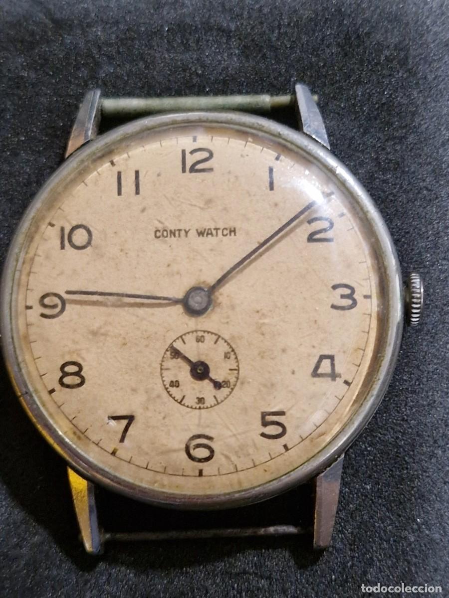 Relojes de pulsera: Reloj Conty Watch a&ntilde;os 40, funciona perfecto. Tapa trasera Omega.