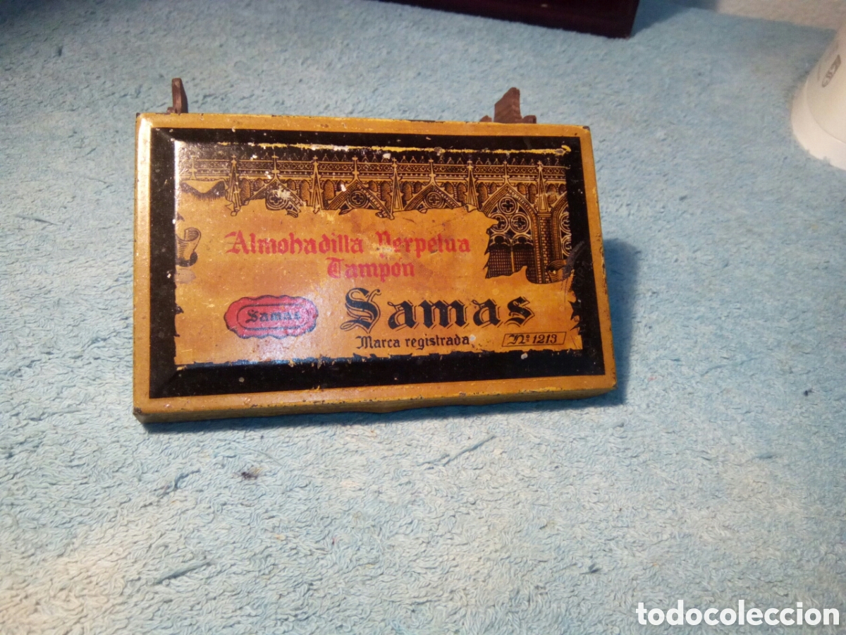 Rel&oacute;gios - Lotus: Almohadilla tamp&oacute;n met&aacute;lica de la marca. Samas