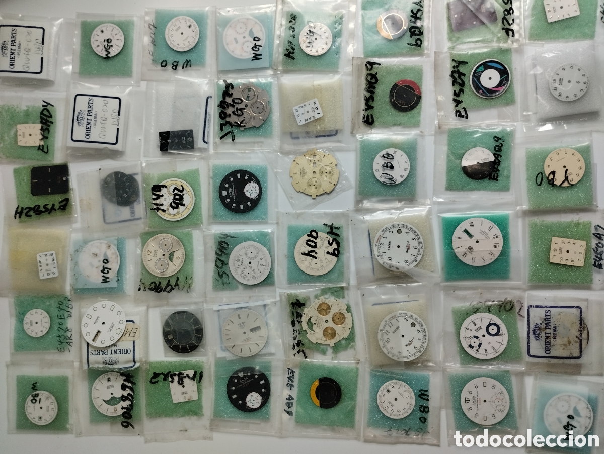 Recambios de relojes: Especial lote relojes Racer esferas cuerpos cristales etc. Mucho material para relojero.