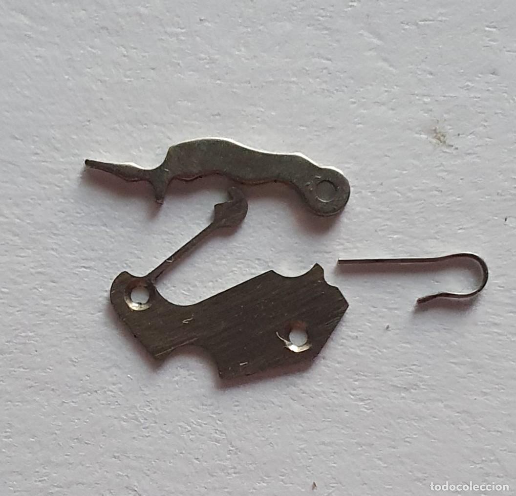 Pi&egrave;ces de rechange de montres et horloges: MUELLES TRNQUETE AS 1215