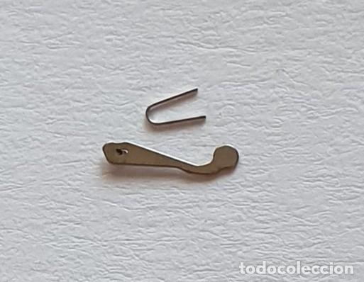 Ricambi di orologi: TRINQUETE Y MUELLE FE 163