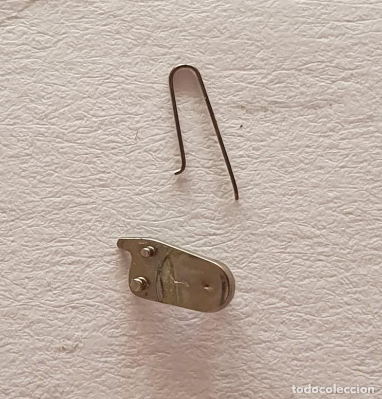 Ersatzteile f&uuml;r Uhren: TRINQUETE Y MUELLE PESEUX 7040-7060