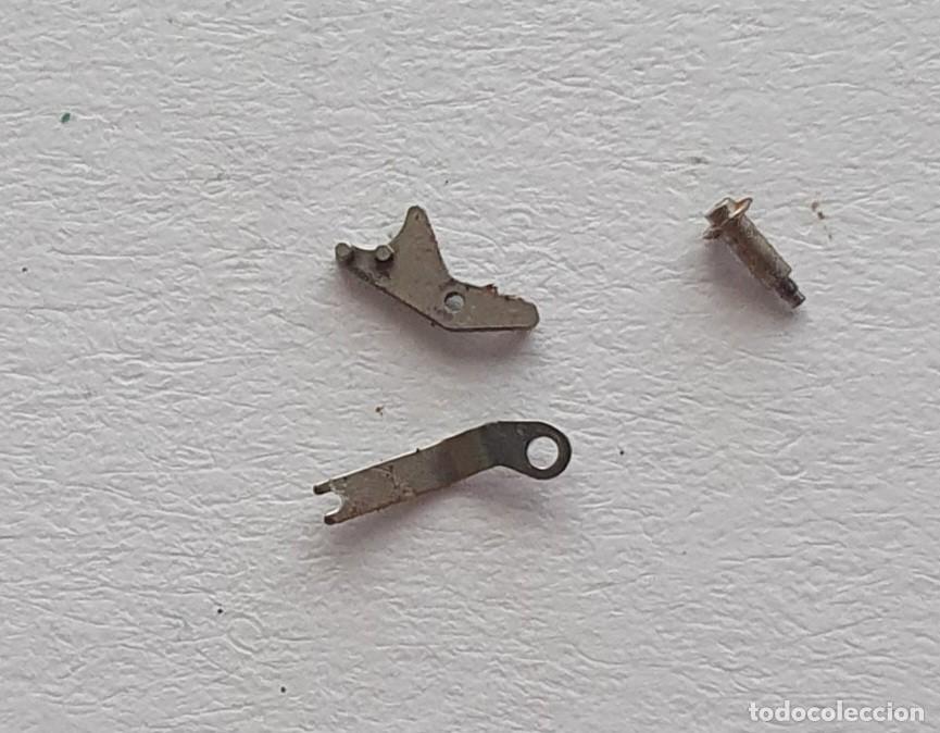 Recambios de relojes: tire reloj Y TORNILLO ORIENT 49741 - Foto 1