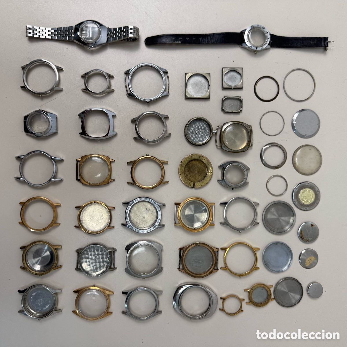Recambios de relojes: Lote 48 piezas de relojes de pulsera. Cuerpos tapas aros, etc.