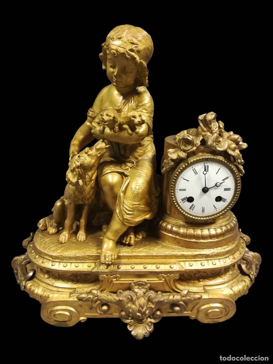 Horloges &agrave; remontage manuel: RELOJ DE CALAMINA DORADO NI&Ntilde;O CON PERROS