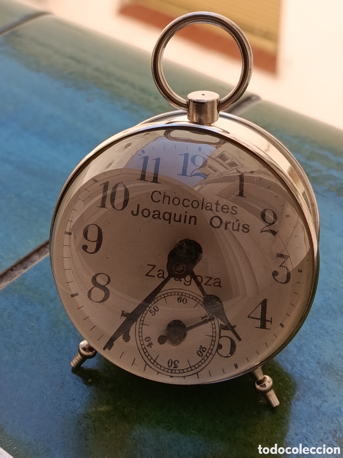 Relojes de carga manual: Antiguo reloj de sobremesa publicitario Chocolates Or&uacute;s PP. S. XX. nuevo sin uso no funciona
