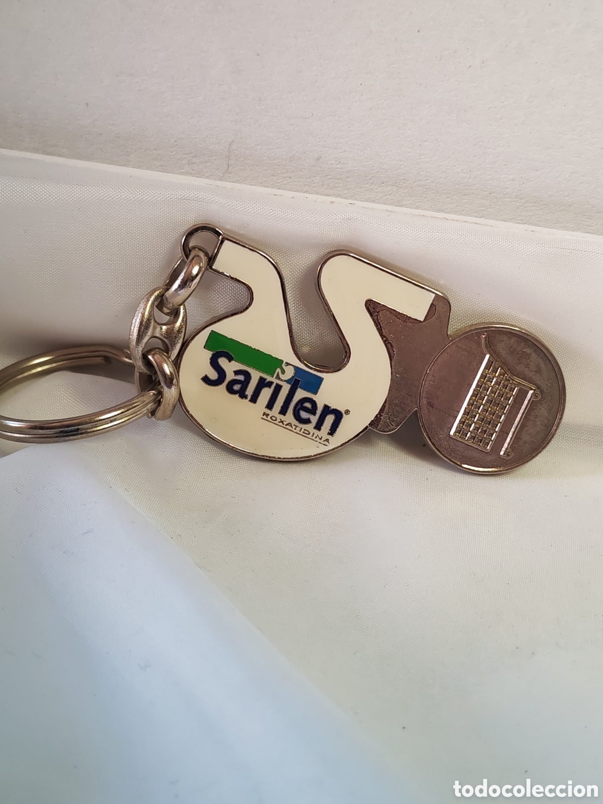 Relojes: Llavero publicitario de la la marca Sarilen. 1990/2000