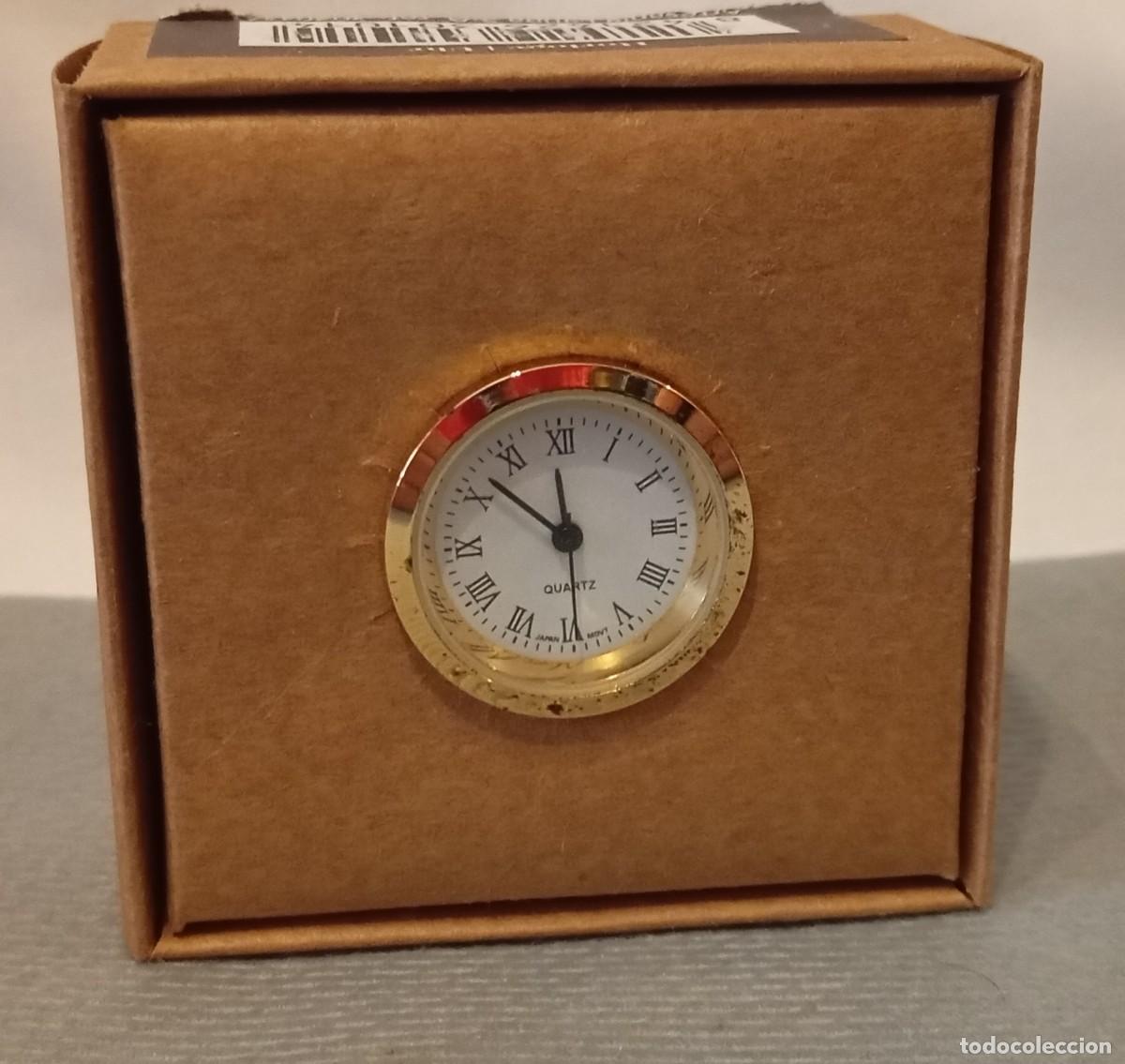 Relojes: Reloj de cuarzo con un elegante bisel dorado