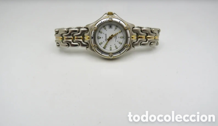 Relojes: Este reloj vintage de la marca Ingersoll cuenta con una correa de acero inoxidable bicolor plateada
